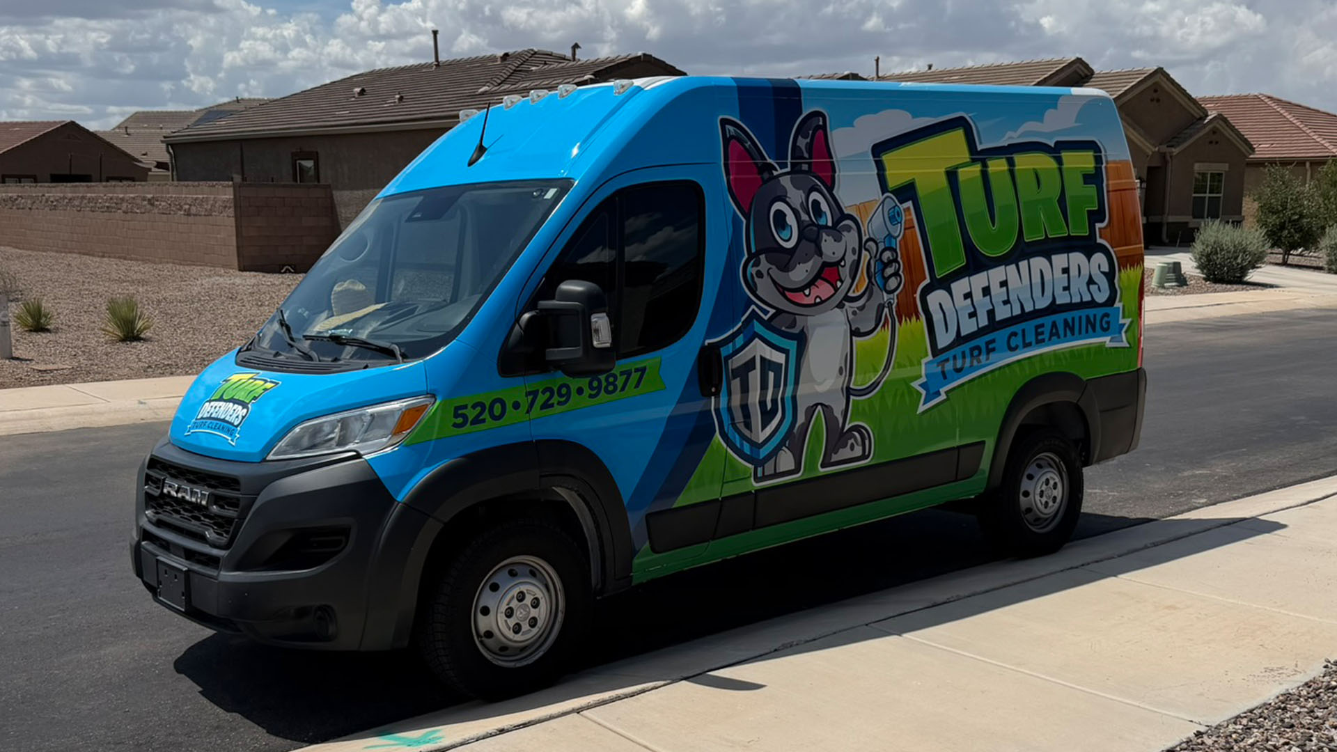 Turf Defenders branded service truck in a Tucson neighborhood